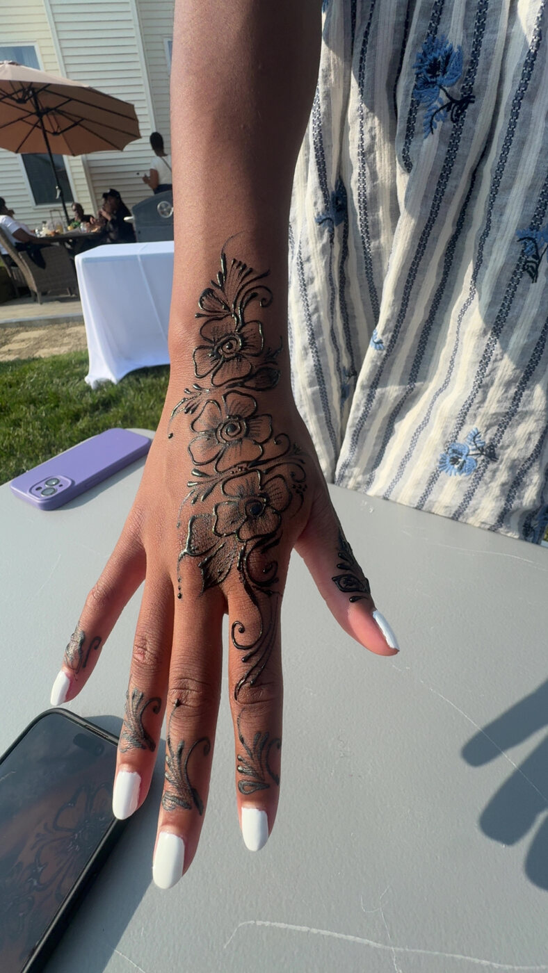 Flowing floral hand henna