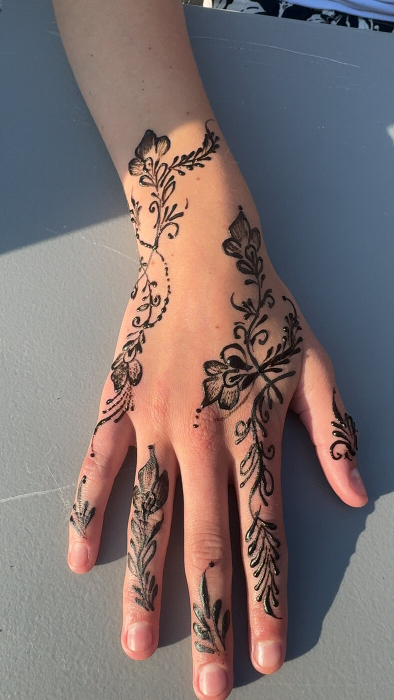 Floral hand and fingers henna