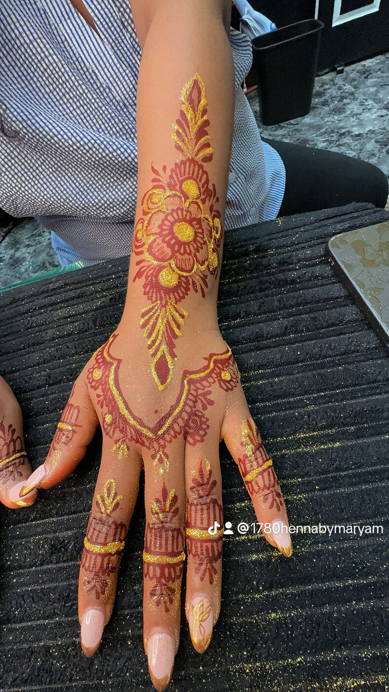Gilded floral hand henna